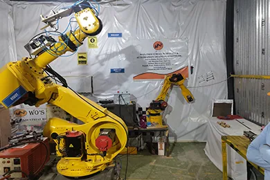 A WO robot cell assembled and fenced for trials before dispatch.